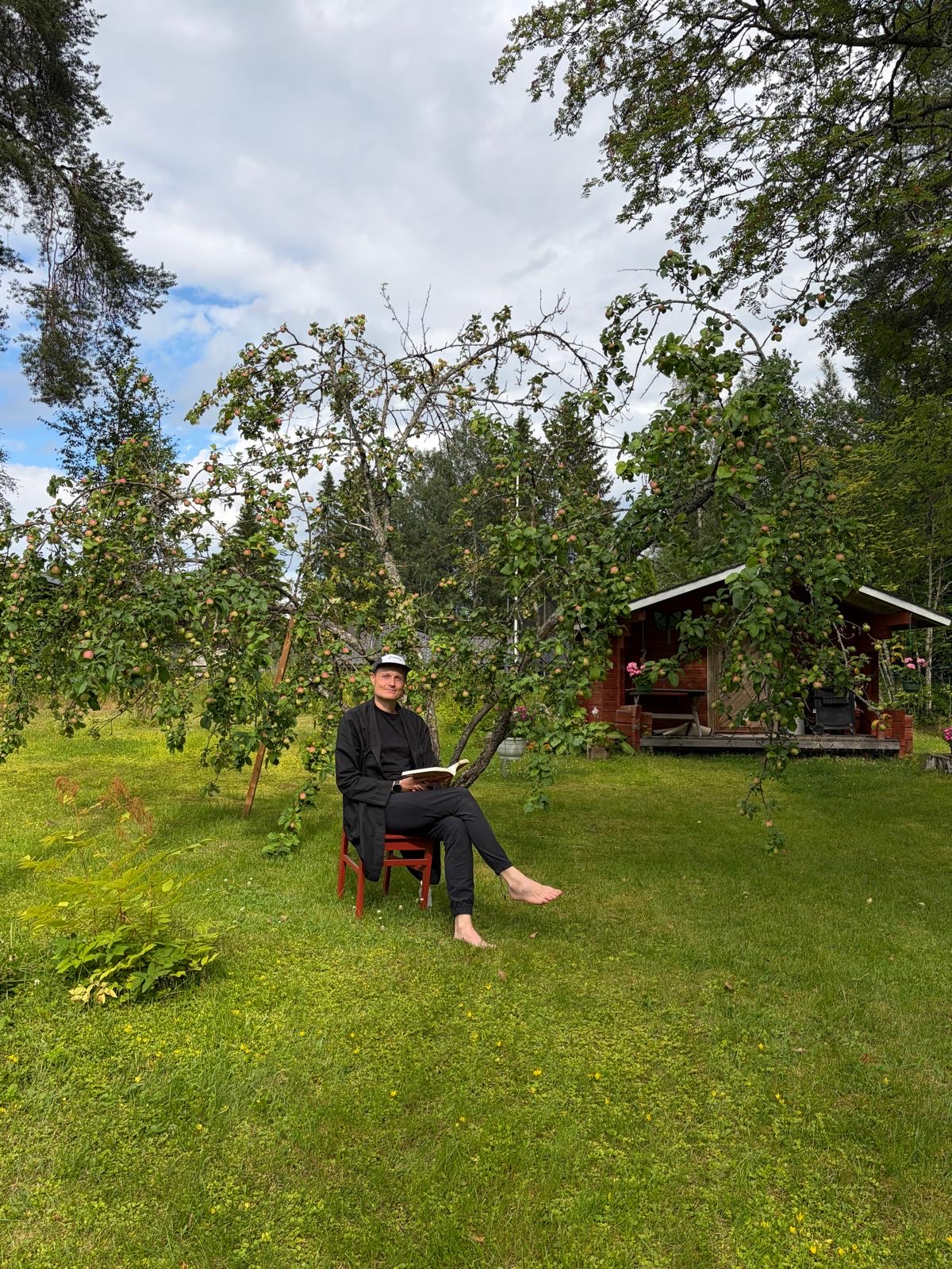 Lauri Palsa photographed outdoors in an orchard